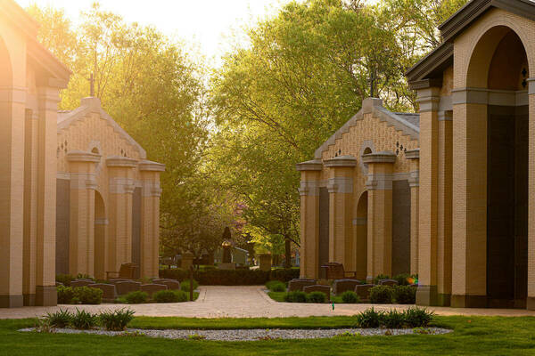 Mausolea in Cedar Grove Cemetery with the sun shining down