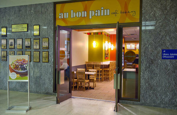 Exterior of Au Bon Pain café with yellow awning