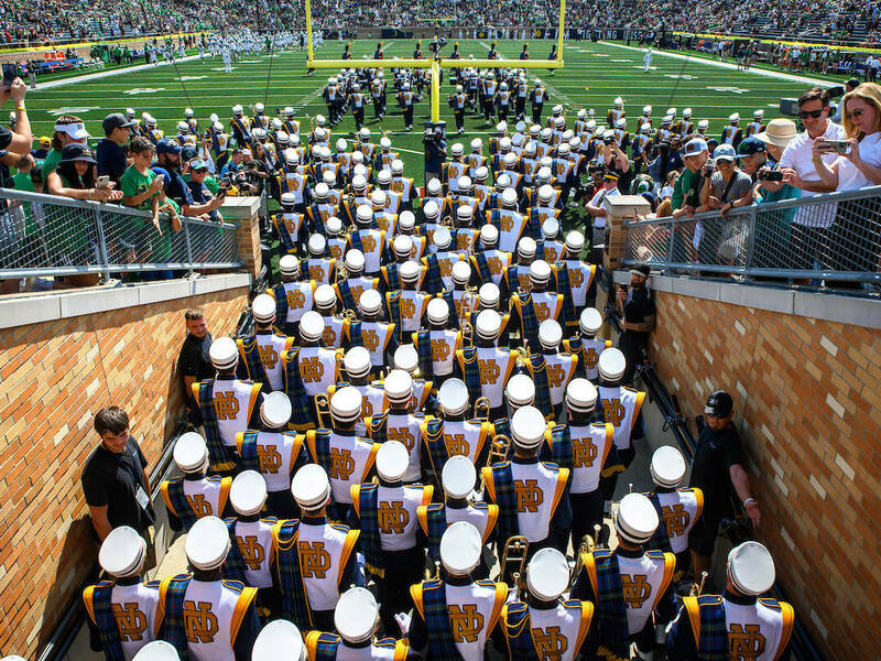 Notre Dame Marching Band overhead shot coming out of the football tunnel