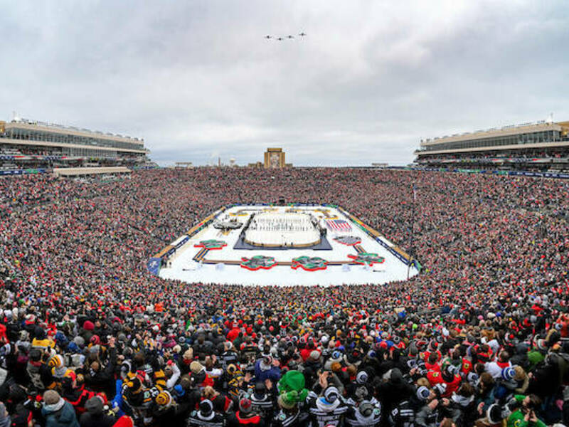 Wide overhead shot of Notre Dame Stadium filled with a crowd for the Winter Classic hockey game with ice rink in the center