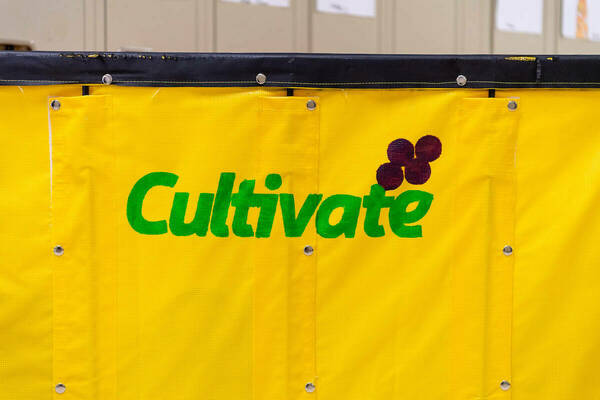 Yellow bin with green Cultivate logo