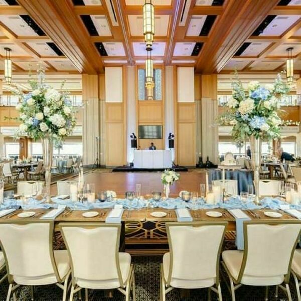 Dahnke Ballroom set up with flowers and light blue décor for a wedding.
