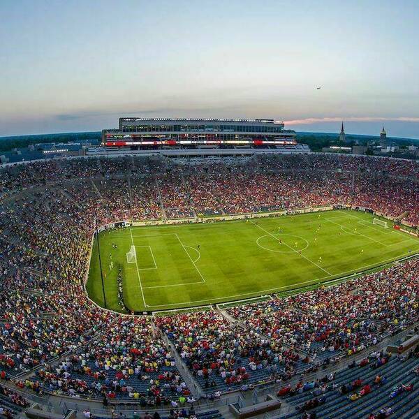 Notre Dame stadium turned into a soccer field for the Liverpool Dortmund Friendly. Guests fill the stadium seats.