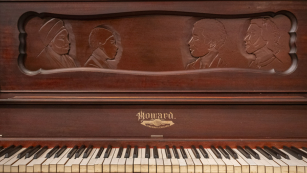 Old brown wood Howard Piano
